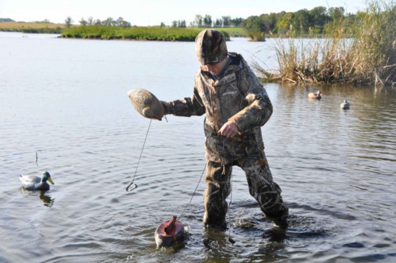 Young_boy_hunter_with_duck_hunting_gear